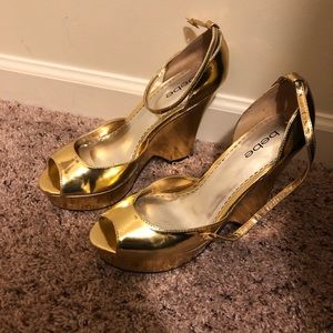 Bebe platform peep toe sandals in gold